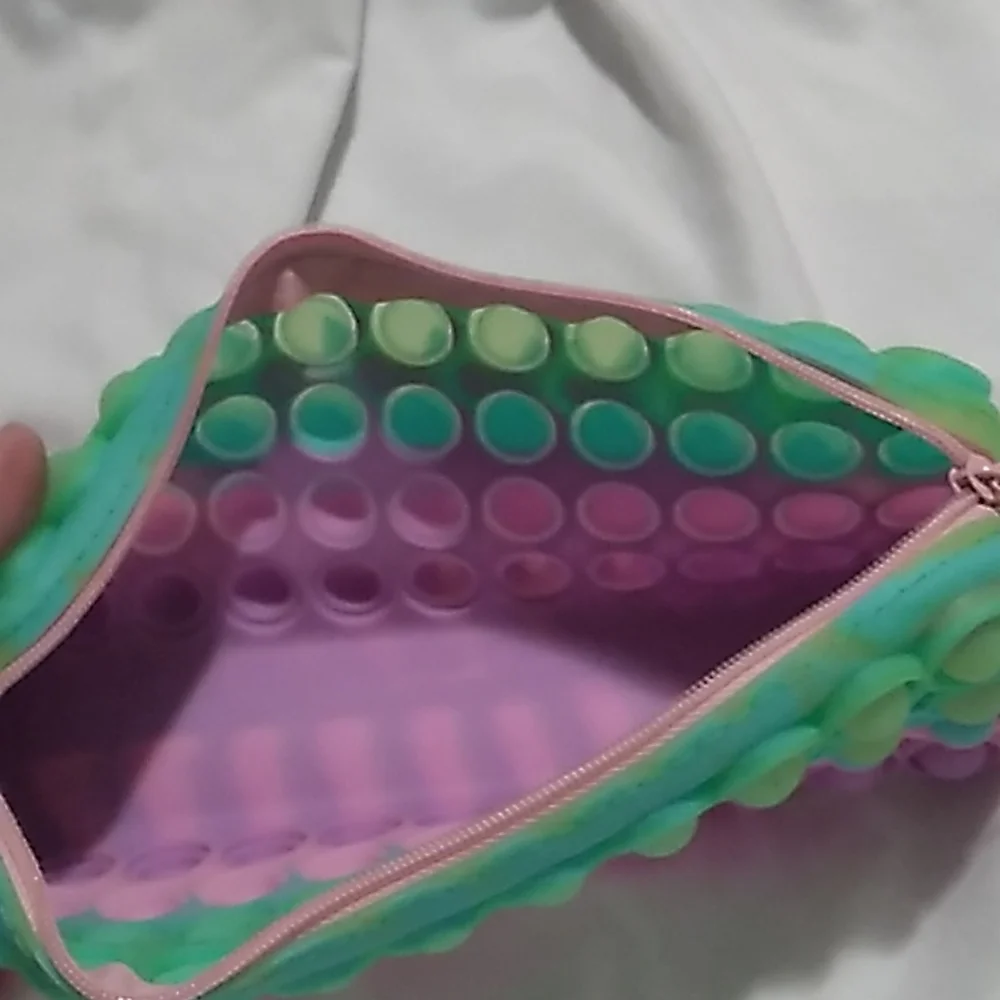 8 x 3 x 1 1/4 inches Purple, pink & green Pop It Case